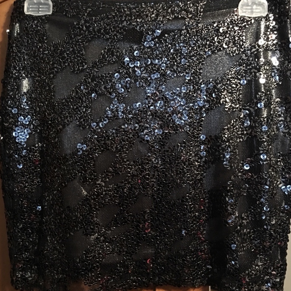 Sequin faux leather look mini skirt.
